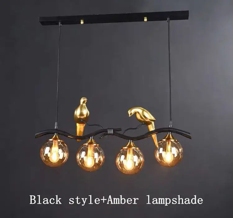 Modern black and gold bird glass pendant lights featuring a black metal chandelier with amber glass globe lampshades