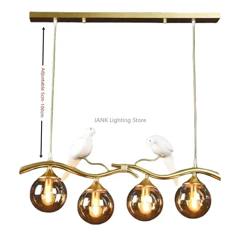 Modern black and gold pendant lights with four amber glass globes and white ceramic dove figurines for dining room