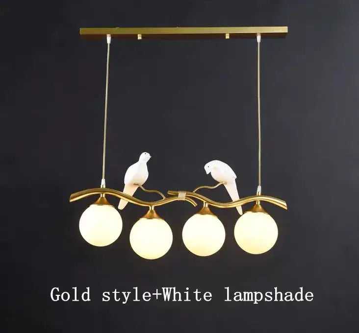 Modern black and gold glass pendant lights with four white spherical lampshades and sculpted white dove decor