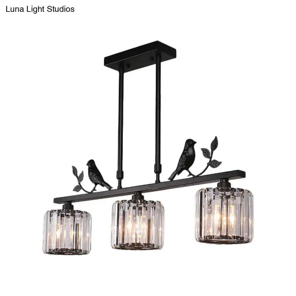 Black metal DecorBites™ chandelier with three clear crystal drum shades and black gold bird accents on a branch
