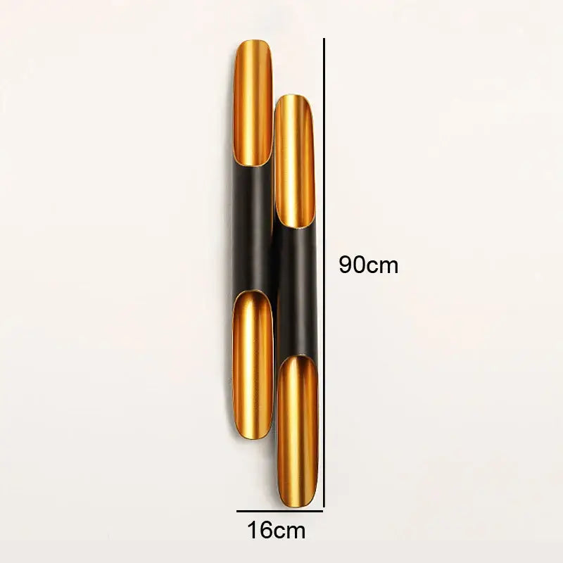 Modern black and gold blade pendant light featuring a sleek cylindrical gold and black metallic wall sconce decorbites coltrane pendant