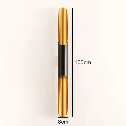 A sleek 100cm tall modern black and gold pendant light with polished and matte metal sections for dining room decorbites coltrane pendant light