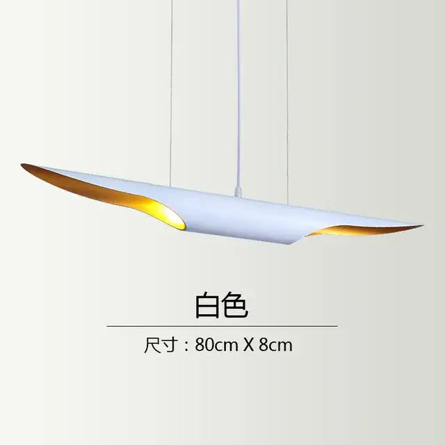 A sleek white decorbites coltrane pendant light with gold-accented edges and a modern elongated oval design for dining room decor