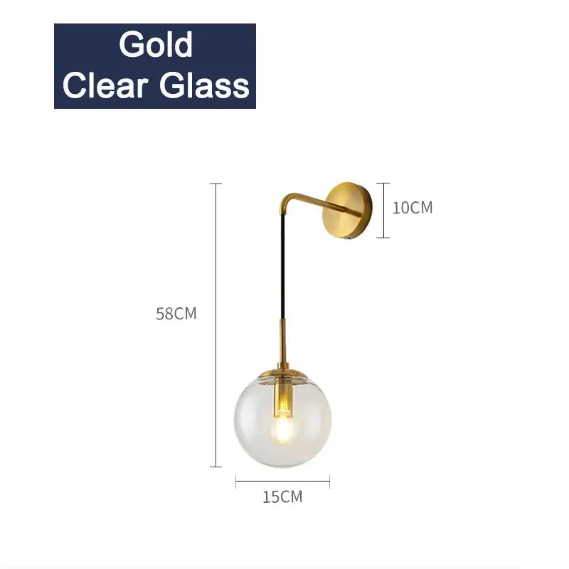 Gold-finished wall sconce with clear glass globe and black cord for modern black and gold branching bubbles chandelier decorbites