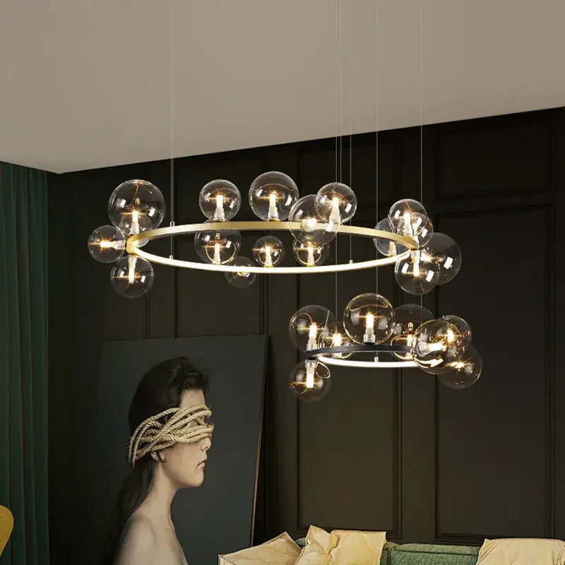 Modern black and gold branching bubbles chandelier with clear glass globe bulbs and circular metal frames for dining room decorbites branching bubbles