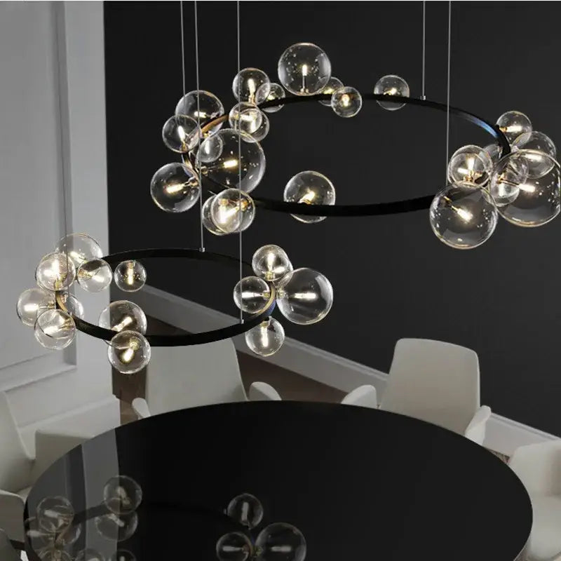 Modern black and gold branching bubbles chandelier with glass bubbles and circular frames for dining room decorbites lighting