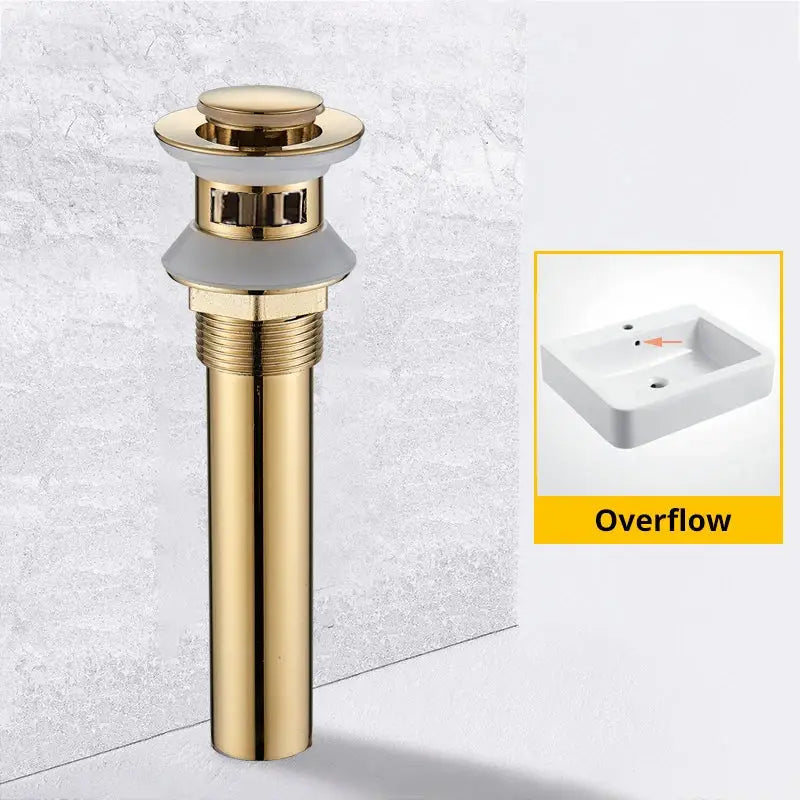 Modern black and gold brass basin sink pop up drain with a gold-toned metal overflow and ridged circular top cap