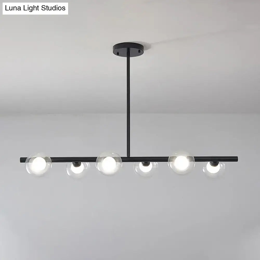 Modern black and gold ceiling light with five bubble clear glass globes for clear glass island dining room use