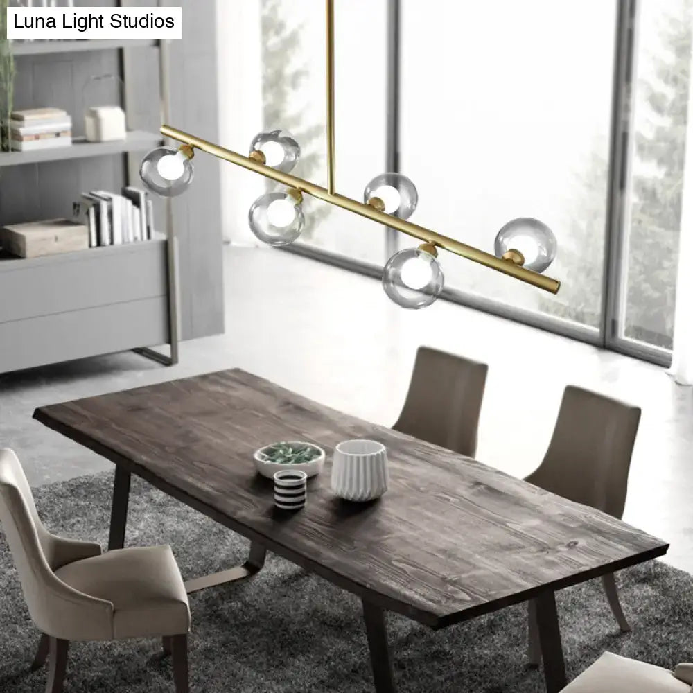 Modern black and gold brass ceiling light with five bubble clear glass globe bulbs for dining room island use