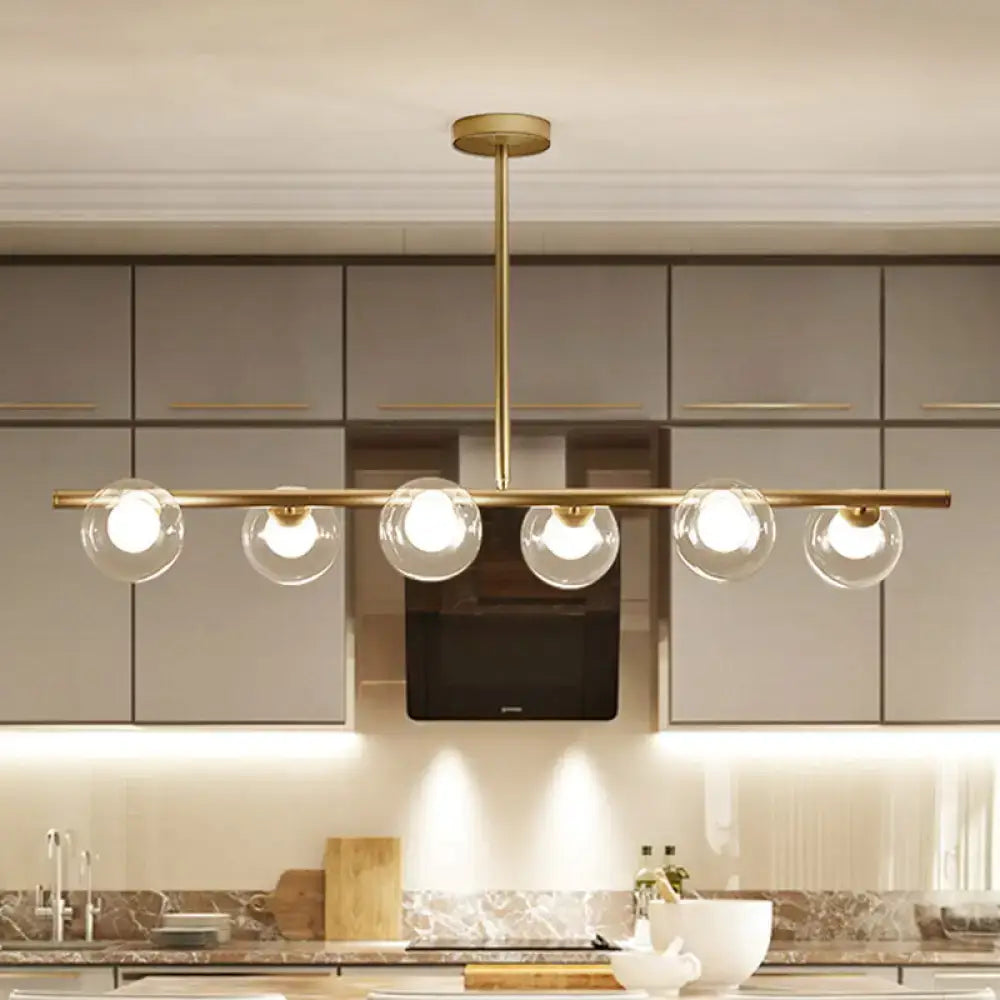 Modern black and gold ceiling light featuring five bubble clear glass globe bulbs for clear glass island dining room use