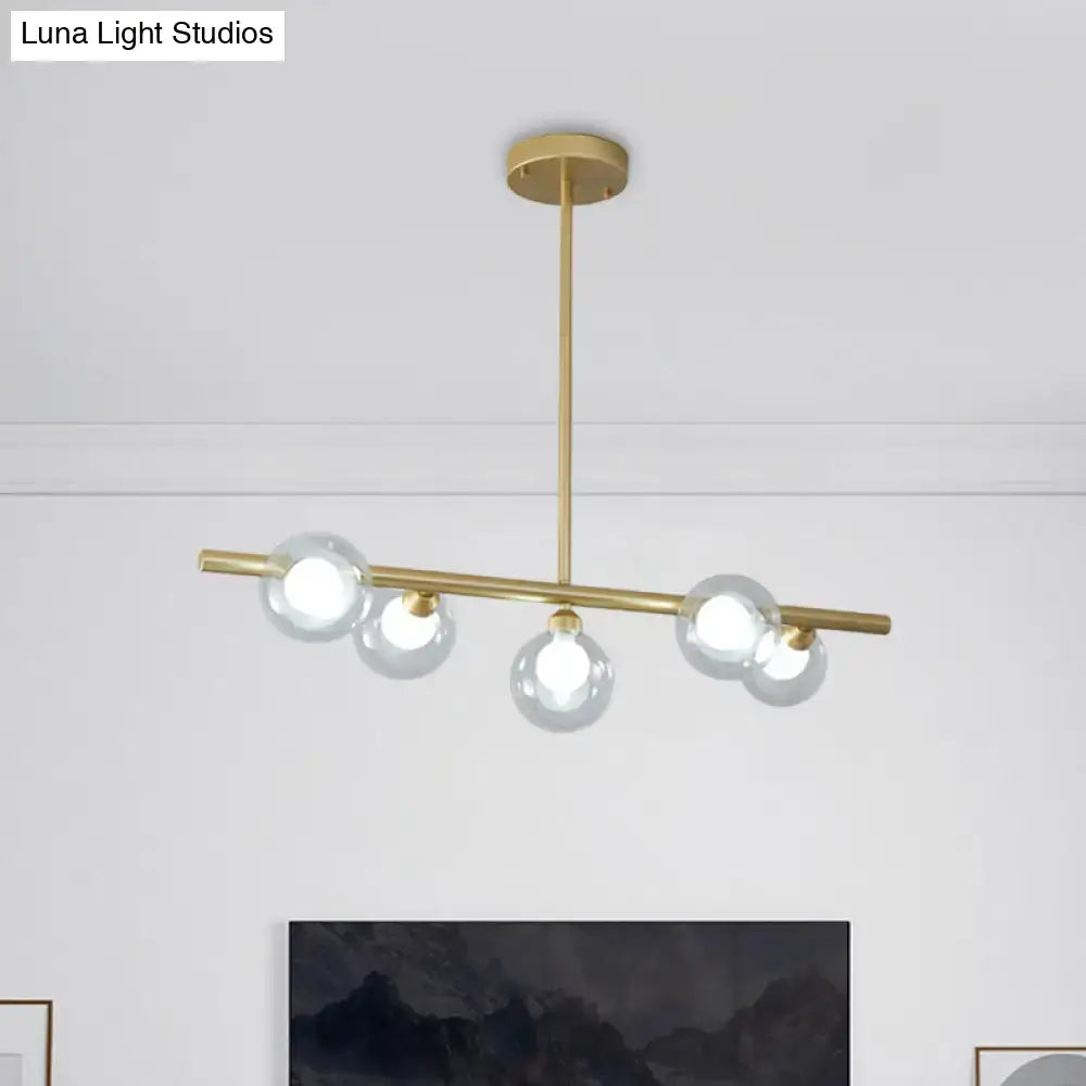 Modern black and gold ceiling light with five bubble clear glass globes for clear glass island dining room lighting