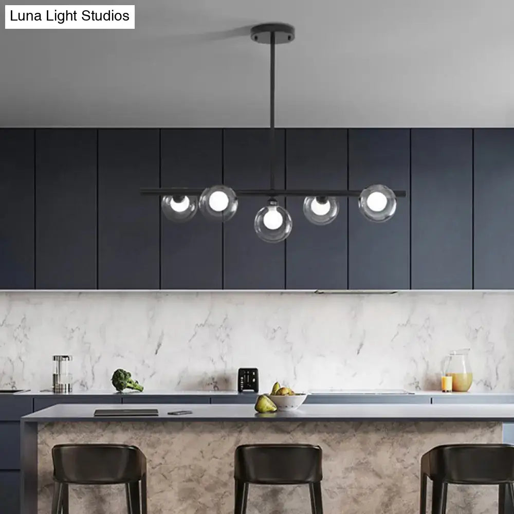 Modern black ceiling light with five bubble clear glass globes for clear glass island dining room illumination