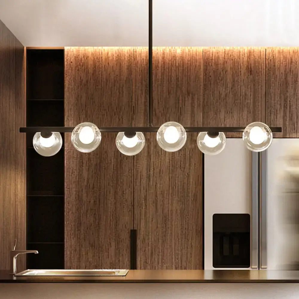 Modern black metal ceiling light with five bubble clear glass globe bulbs for clear glass island dining room use