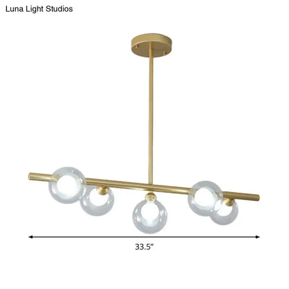 Modern black and gold ceiling light with five bubble clear glass globes for dining room clear glass island use