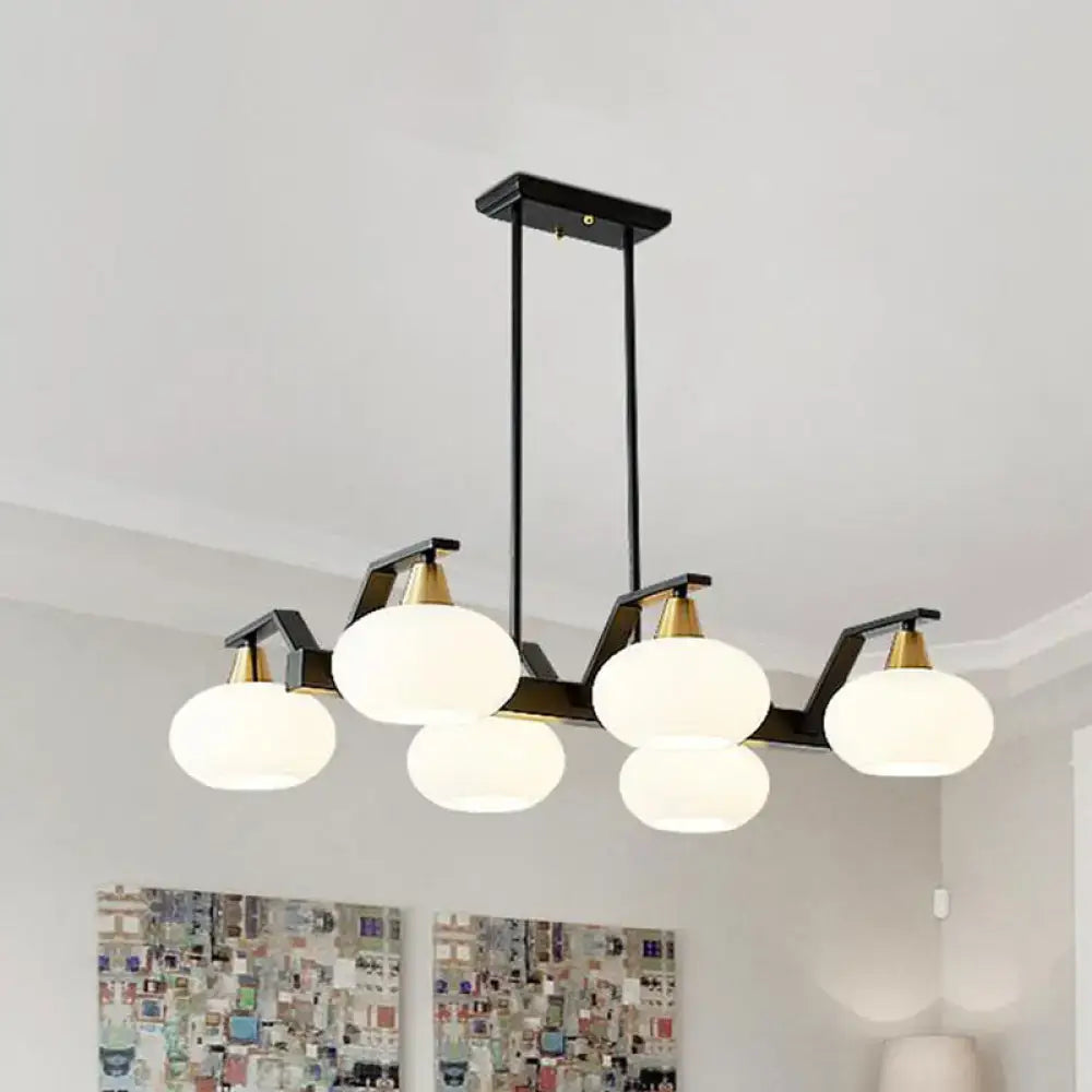 DecorBites black modern chandelier with brass fixture height and five frosted white oval glass shades 220v-240v compatible