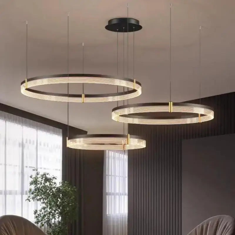 Modern black and gold circular pendant light with warm led rings featuring decorbites black acrylic led finish
