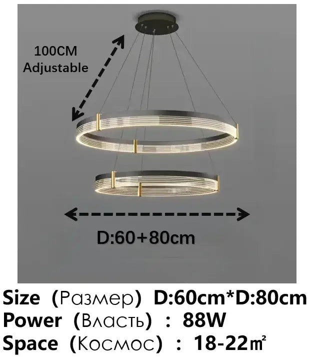 Modern black and gold circular pendant light featuring sleek metallic rings with warm glowing black acrylic led decorbites design