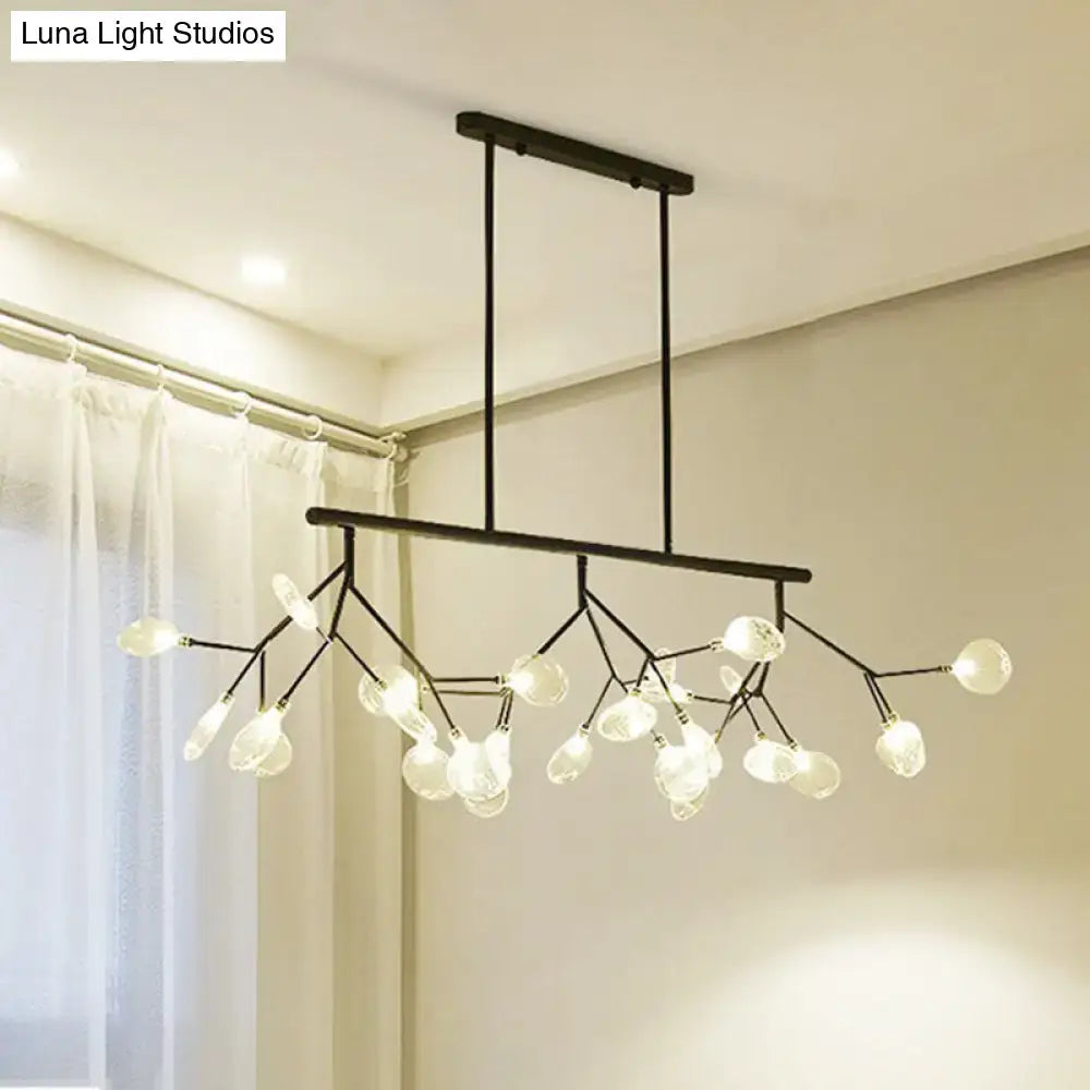 Modern black and gold dining room chandelier with clear glass globe bulbs in a branching tree-like design