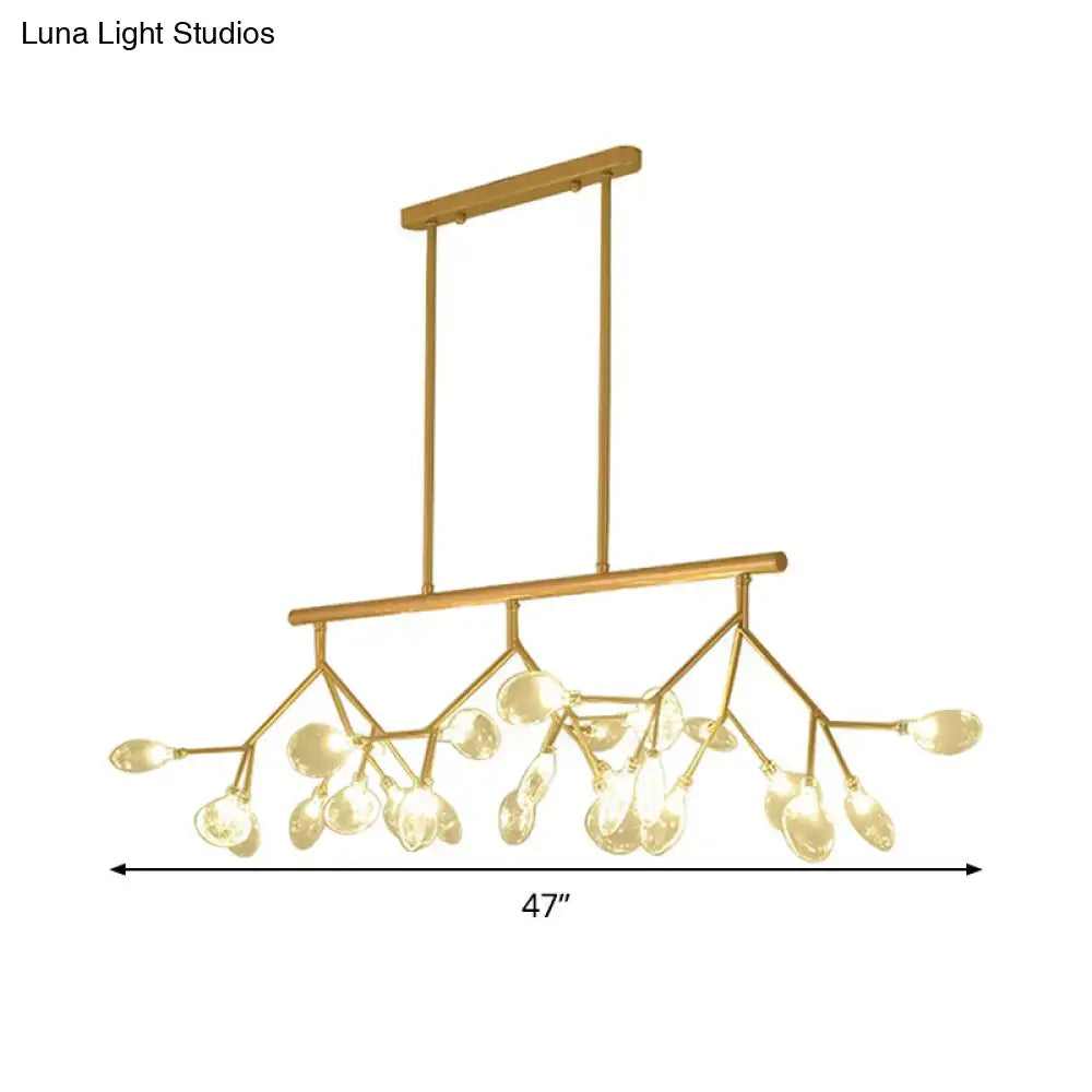 Modern black and gold clear glass bubble chandelier with gold-toned branch design and teardrop glass pendants for dining room