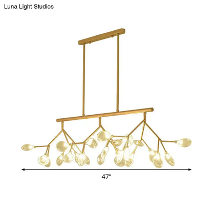 Modern black and gold clear glass bubble chandelier with gold-toned branch design and teardrop glass pendants for dining room