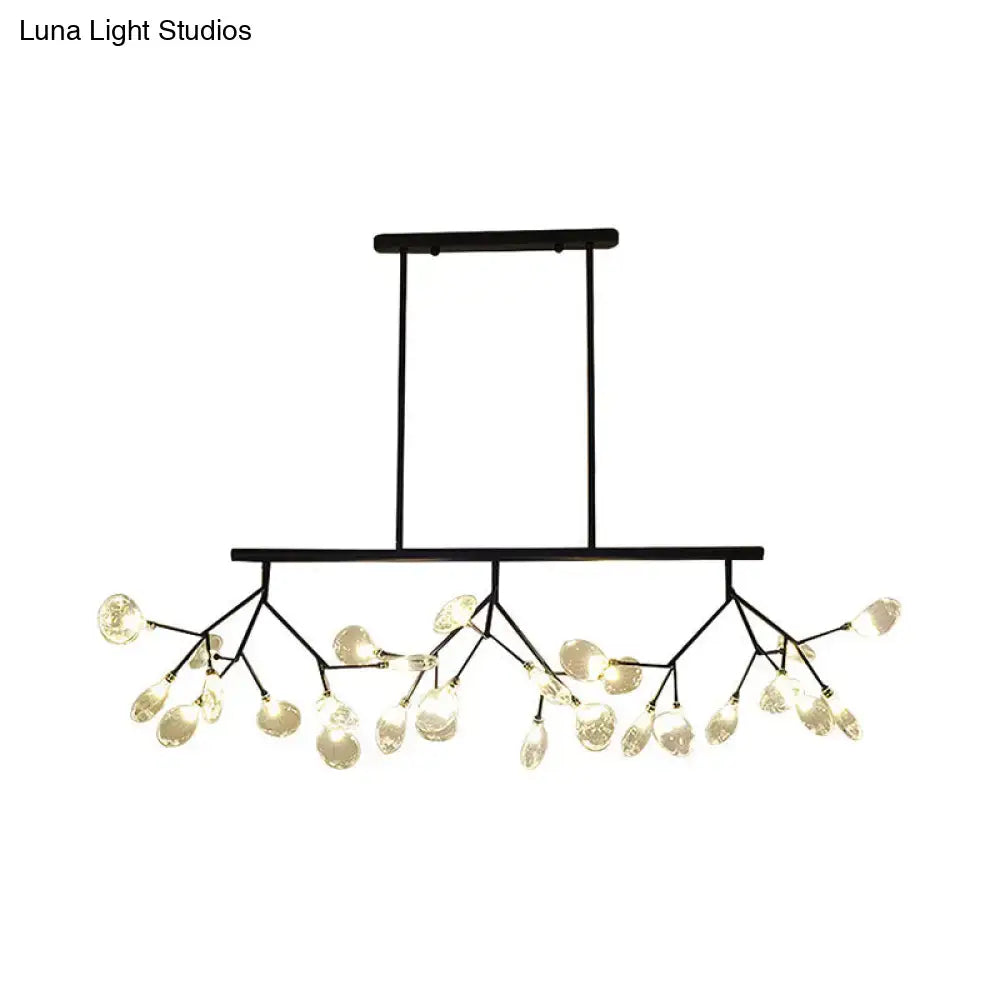 Modern black metal chandelier with branching arms and clear glass teardrop pendant lights for dining room use