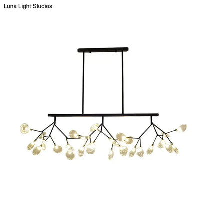 Modern black metal chandelier with branching arms and clear glass teardrop pendant lights for dining room use