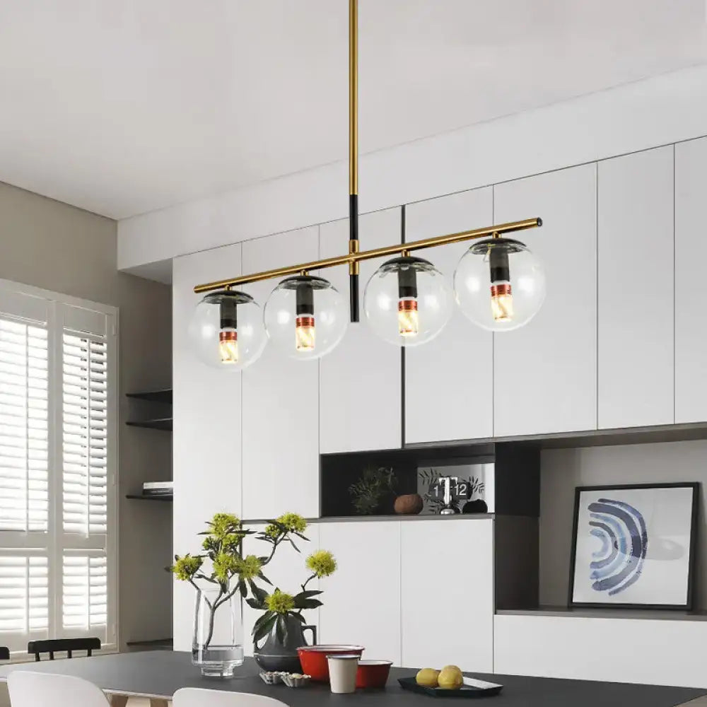 Modern black and gold pendant light with four clear glass globe shades and exposed filament bulbs 110v-240v compatible