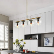 Modern black and gold pendant light with four clear glass globe shades and exposed filament bulbs 110v-240v compatible