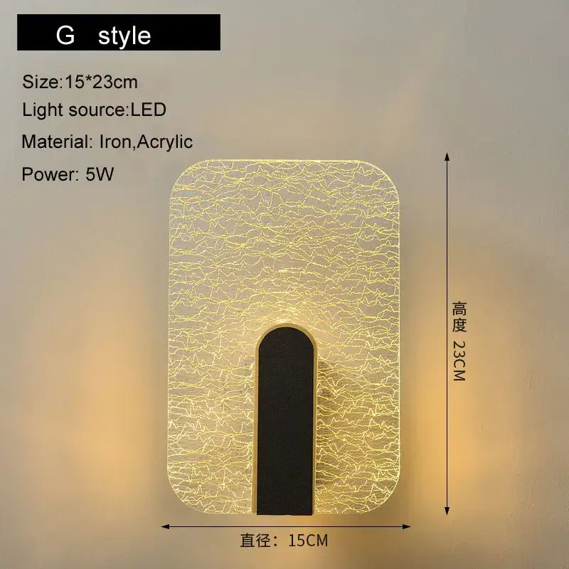 Modern black and gold led wall lamp with crackled acrylic diffuser and iron frame emitting warm yellow light