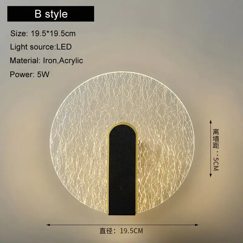 Modern black and gold led wall lamp with crackled acrylic diffuser and iron frame emitting warm bedroom light