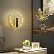 Modern black and gold crackled glass led wall lamp with glowing golden rim and black accent for bedroom lighting