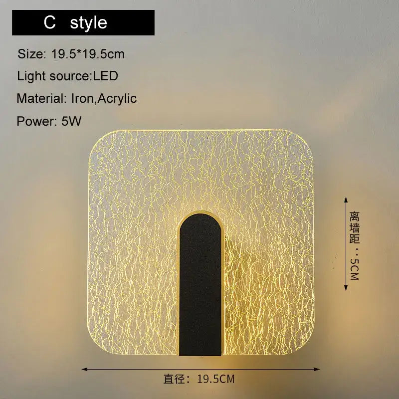 Modern black and gold led wall lamp with crackled acrylic diffuser and iron frame emitting warm yellow light for bedroom