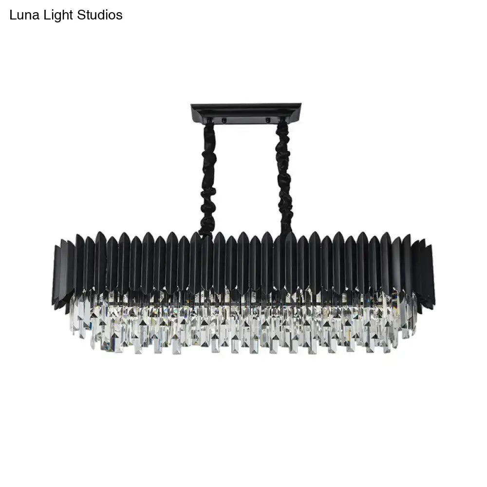 Modern black and gold crystal chandelier with elongated rectangular design featuring faceted prisms and twisted metal chains