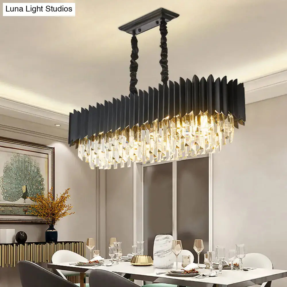 Modern black and gold crystal chandelier with matte black metal frame and cascading clear crystal prisms for dining room