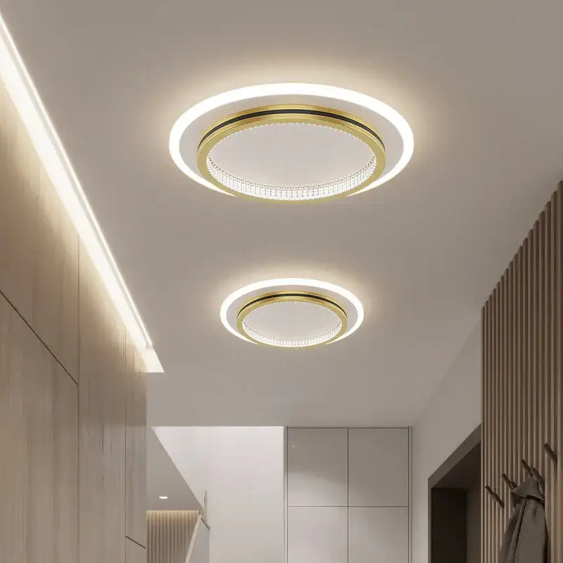Modern black and gold crystal led ceiling lights with circular gold frame and illuminated rings for entrance hallways decorbites crystal led