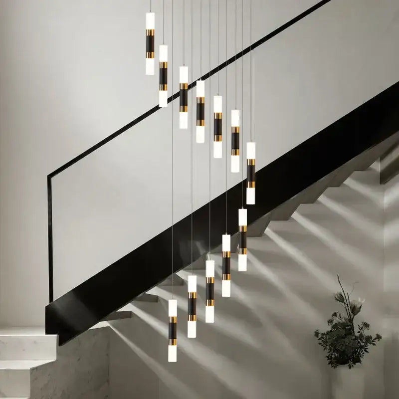 Modern black and gold crystal led chandelier staircase pendant light with sleek cylindrical shades by decorbites crystal led