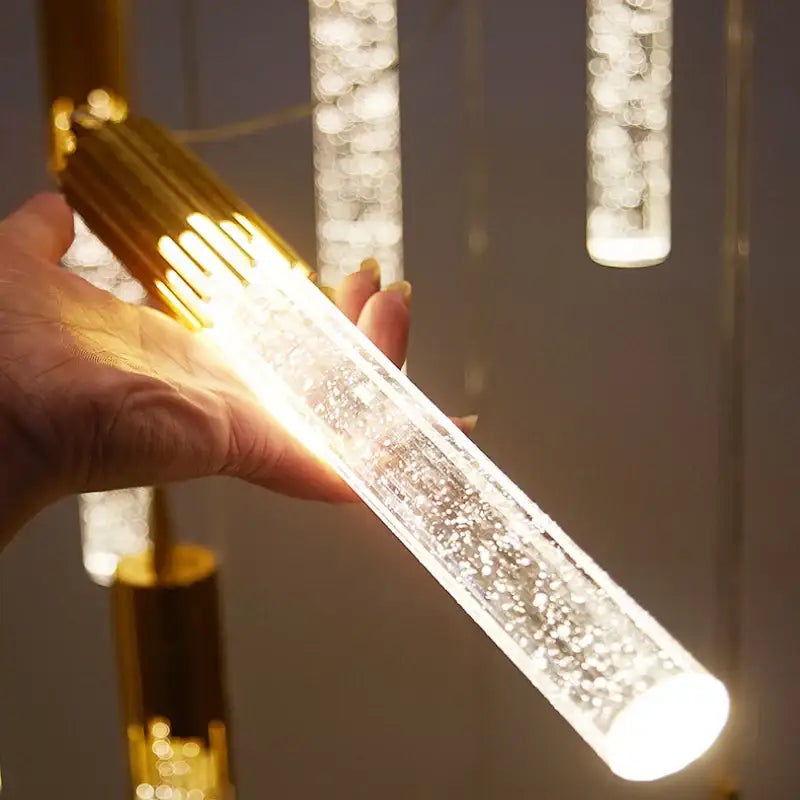 Modern black and gold crystal led pendant lamp with a gold metallic top and clear acrylic bubble-filled body for dining room decorbites crystal led
