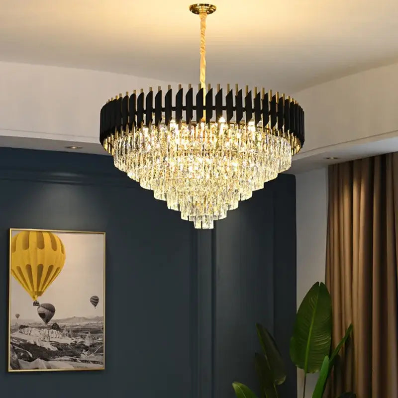 A modern black and gold decorbites crystal led pendant light with a circular frame and cascading crystal prisms for dining room decor