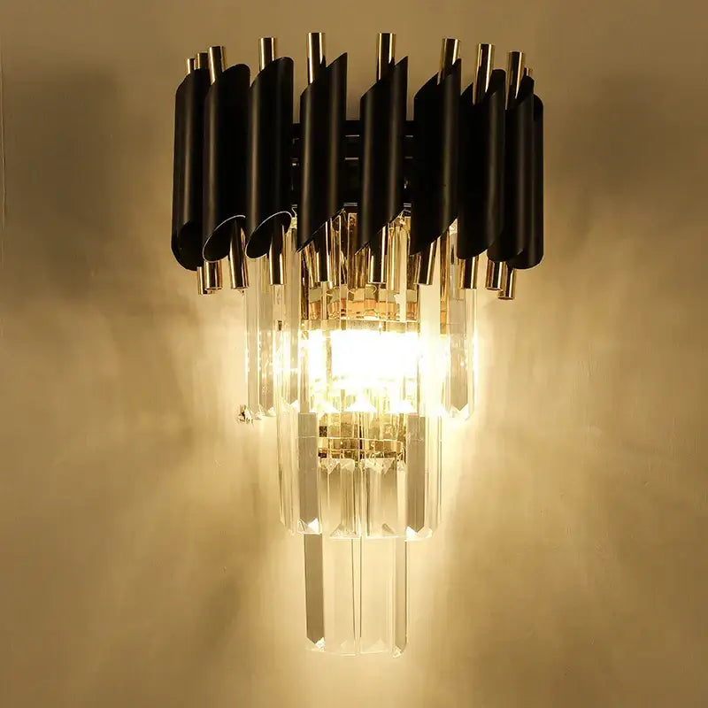 Modern black and gold wall lamp with cascading crystal prisms from decorbites crystal luxury wall collection for bedroom decor