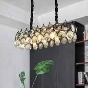 Modern black oval pendant lighting fixture with crystal prism shade and twisted cord for dining room illumination