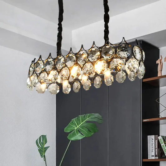 Modern black oval pendant lighting fixture with crystal prism shade and twisted cord for dining room illumination