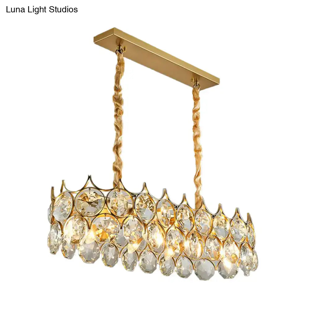 Modern black and gold pendant lighting fixture with crystal prism shade featuring faceted clear crystals and twisted chain suspension