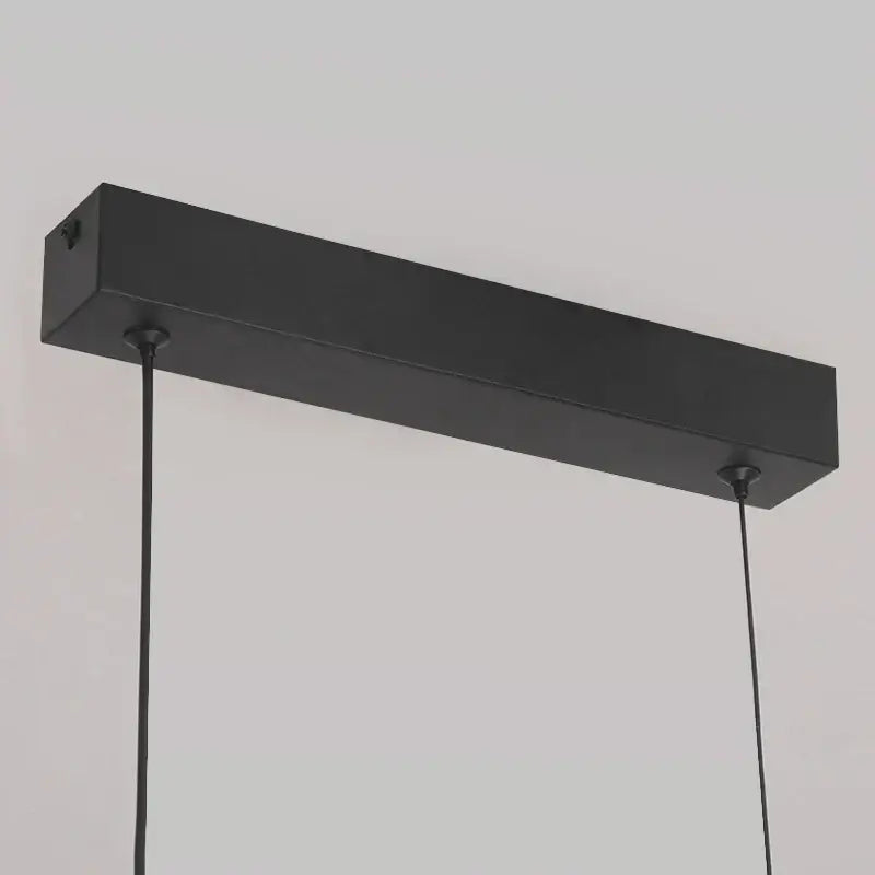 Modern black rectangular pendant light with matte finish and sleek minimalist design for dining table curved bridge