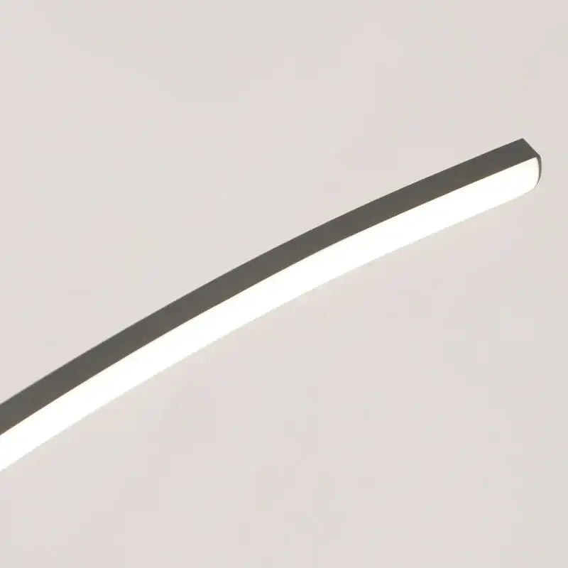Modern black and gold curved bridge pendant light with polished chrome finish and white diffuser for dining table lighting
