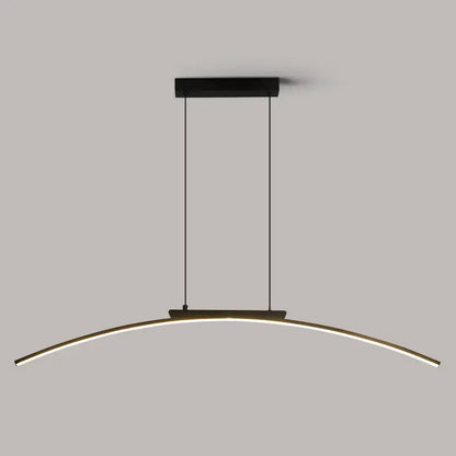 Modern black and gold curved bridge pendant light with sleek LED strip illuminating a dining table area