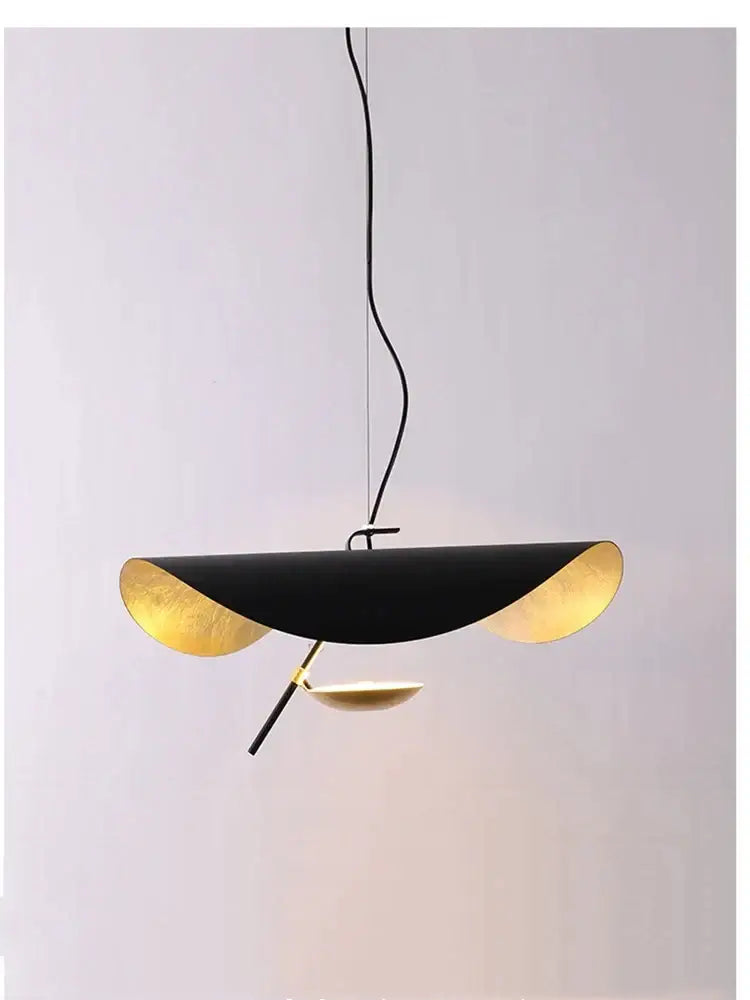 Modern black and gold curved pendant light with sleek design ideal for dining room decorbites lederam manta lamp