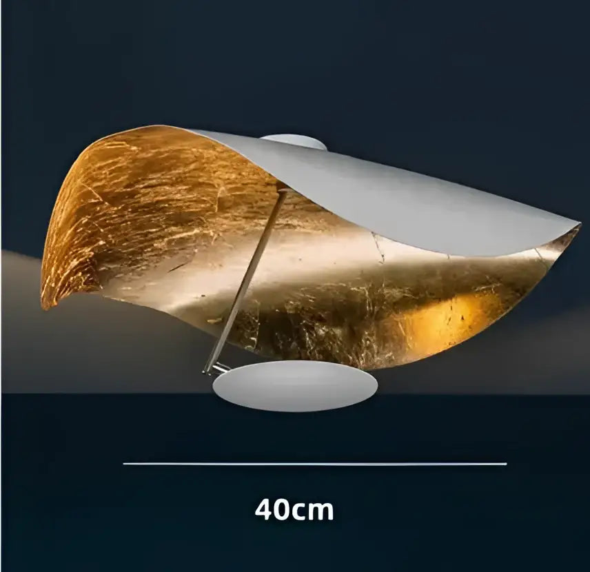 Modern black and gold lederam manta pendant lamp with a flowing metallic shade for dining room decorbites lederam manta