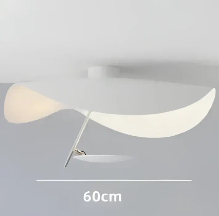 A modern black and gold curved manta pendant lamp with two translucent white panels for dining room lighting decorbites lederam manta