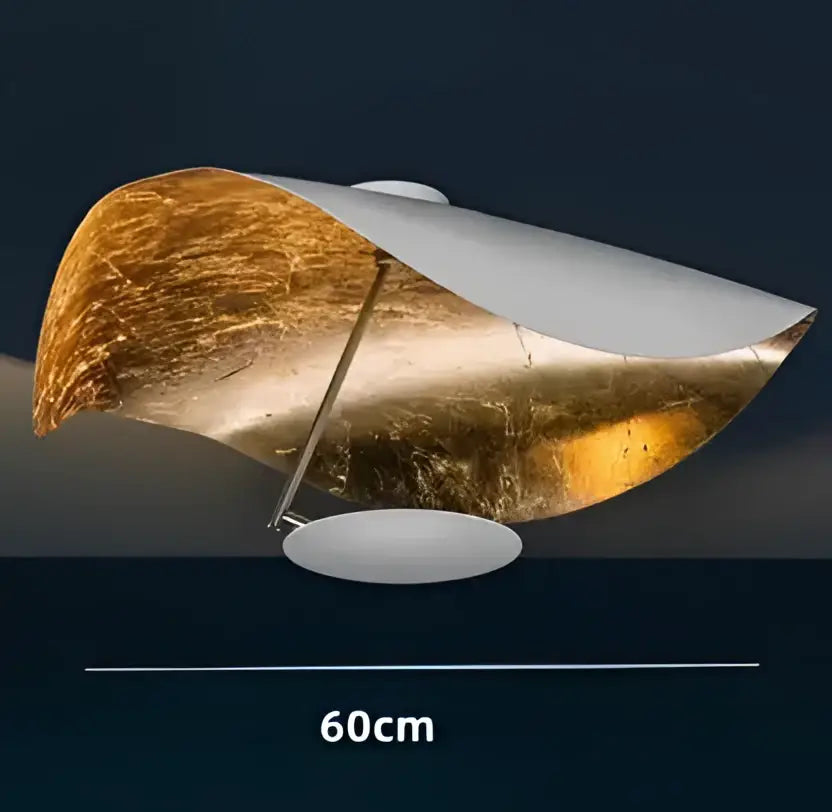 Modern black and gold curved pendant light with a golden metallic shade and white base perfect for dining room decorbites lederam manta