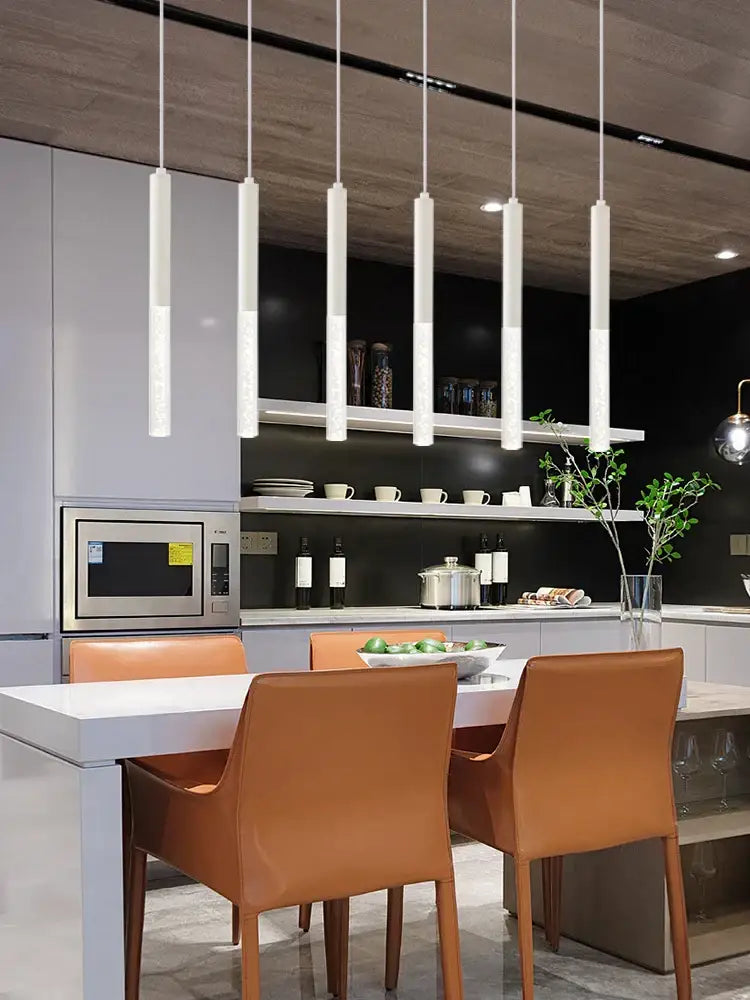 Six sleek white cylinder pendant lights complement decorbites black cylinder pendant kitchen island lighting design